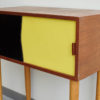 Black and yellow Swedish dresser at an angle
