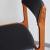 Close up of backrest of Danish black skai dining chair