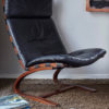 Swedish design black leather lounger by Knudsen in a room