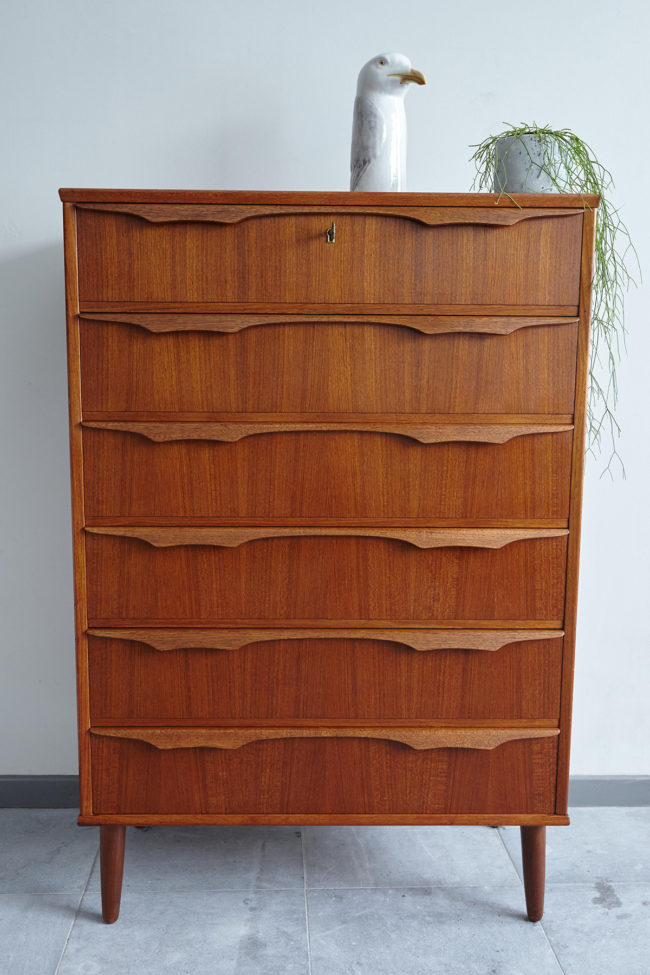 Danish teak chest of drawers with objects