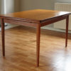 Extendable Danish teak dining table with extensions closed