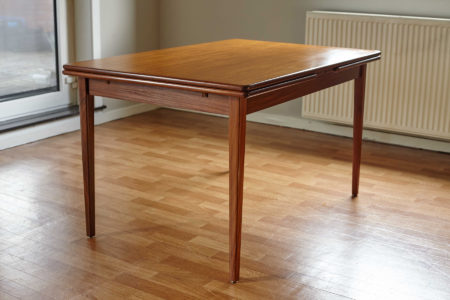 Extendable Danish teak dining table with extensions closed