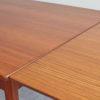 Close up of Danish teak dining table with extension opened