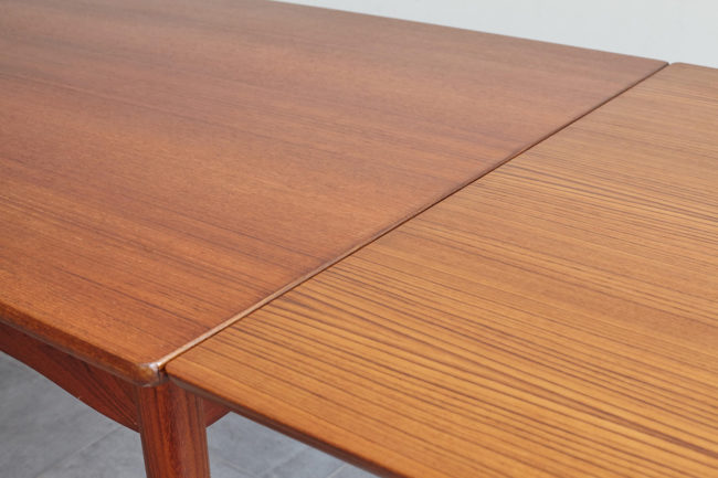 Close up of Danish teak dining table with extension opened