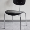 Front view of a Egon Eiermann Wilde Spieth SE68 chair at an angle