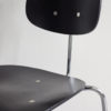 Close up of front view of a Egon Eiermann Wilde Spieth SE68 chair at an angle