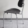 Angled profile view of a Egon Eiermann Wilde Spieth SE68 chair