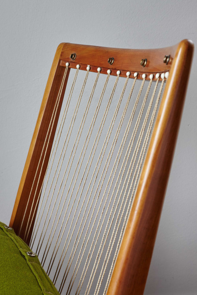 Close up of back frame of Soloform green Boomerang chair