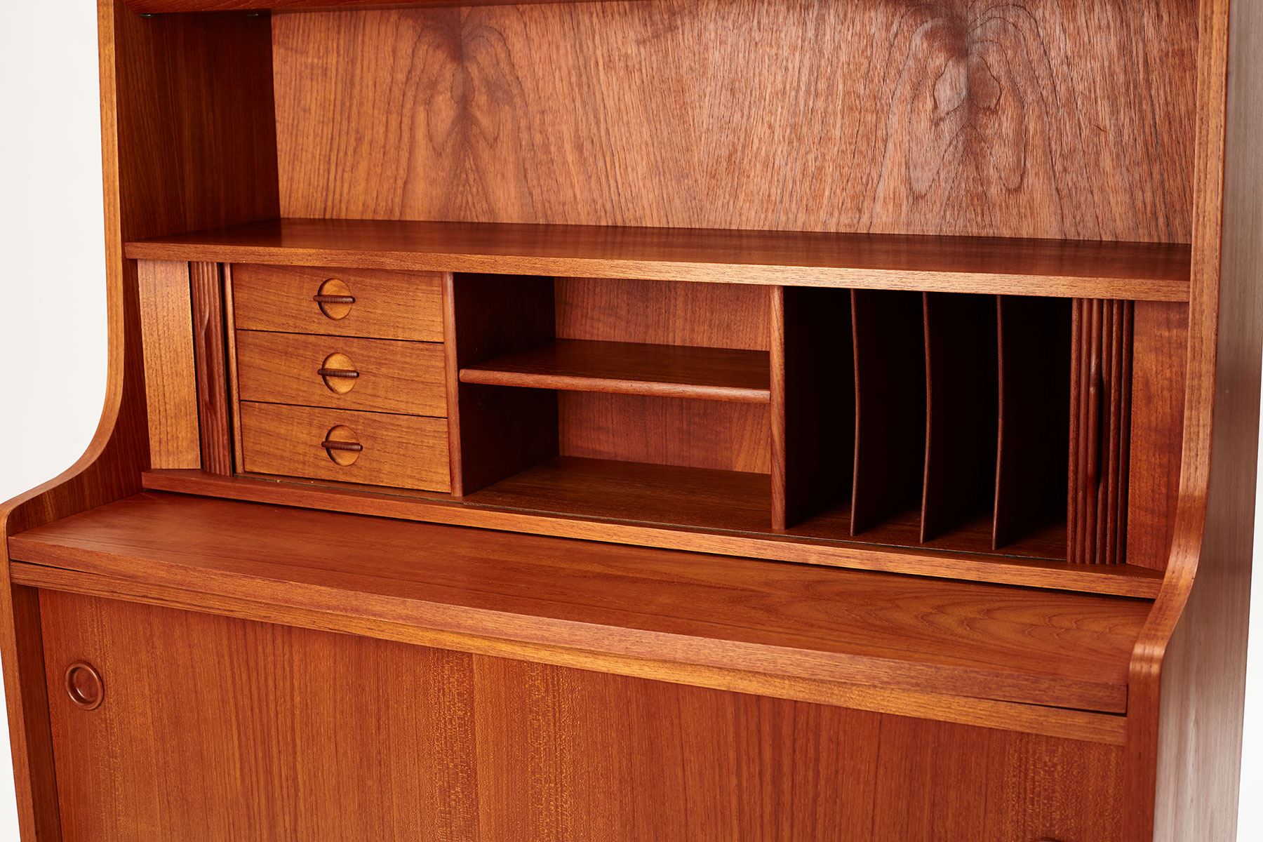 angled view of the storage behind the tambour doors