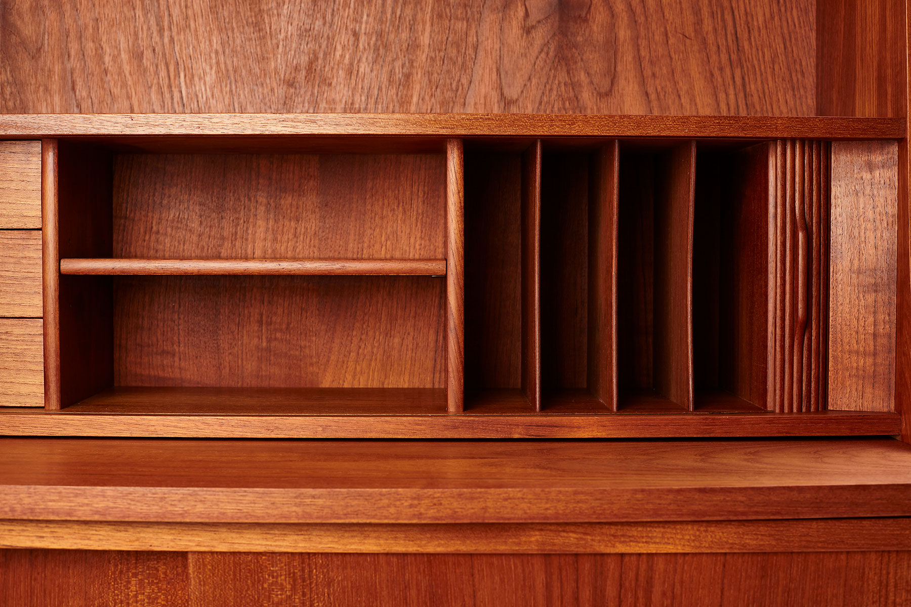 detailed picture of the storage shelves behind the tambour doors