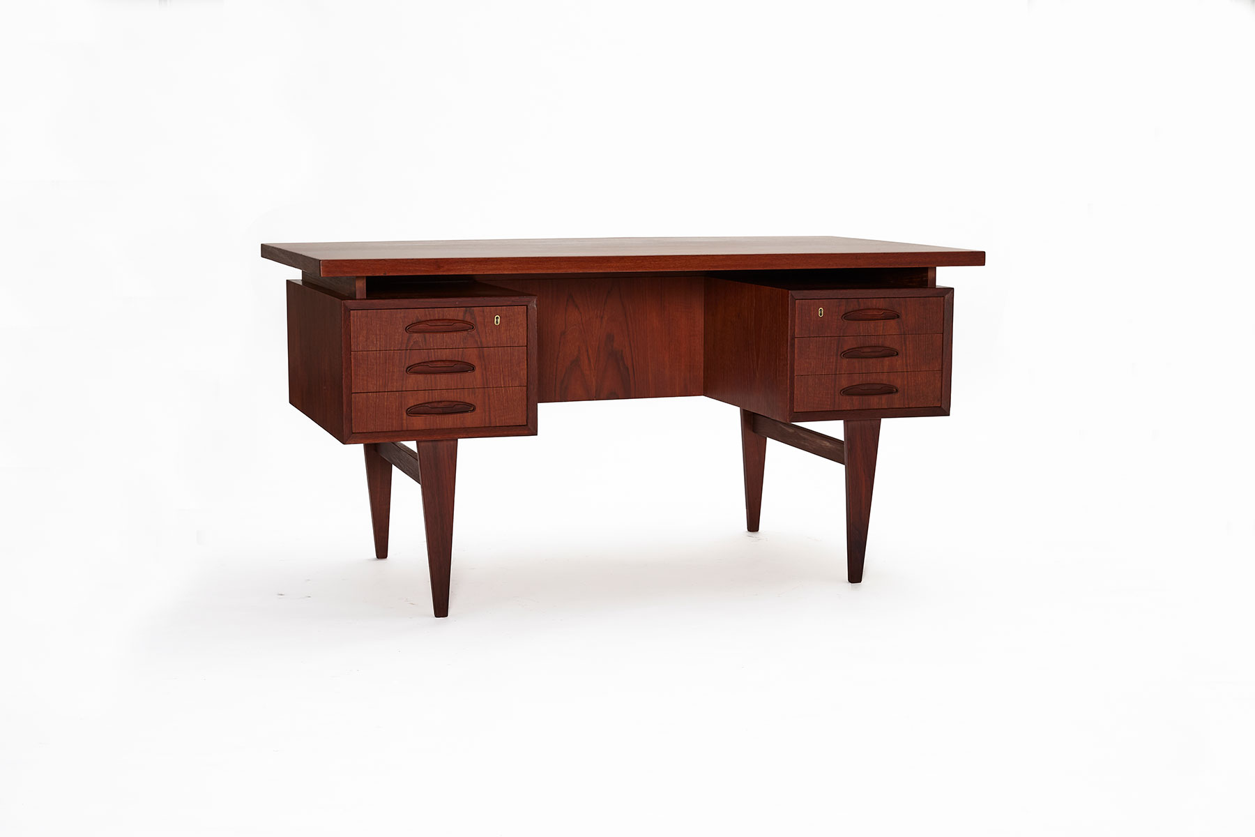 Mid-Century Danish Teak Desk, pictured on a white background